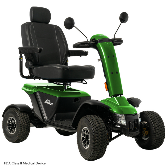 The Pride Baja® Wrangler® 2 Heavy Duty Outdoor Scooter is green, has four wheels, and includes black seating and handlebars. It features CTS Suspension for a smooth ride, adjustable armrests, and front mirrors for better accessibility on rugged terrain.