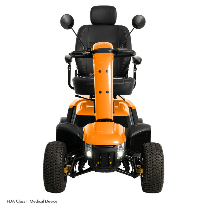 A front view of the bright orange Pride Baja® Wrangler® 2 Heavy Duty Outdoor Scooter shows its four wheels, black seat, and side mirrors. It includes headlights and CTS Suspension for a smooth ride and is an FDA Class II Medical Device designed for rugged terrain.