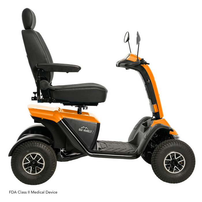 The Pride Baja® Wrangler® 2 is a heavy-duty outdoor scooter in orange and black, featuring a high-back seat, side mirrors, and textured wheels for rugged terrain. It includes CTS Suspension for enhanced stability and comfort and is classified as an FDA Class II Medical Device.