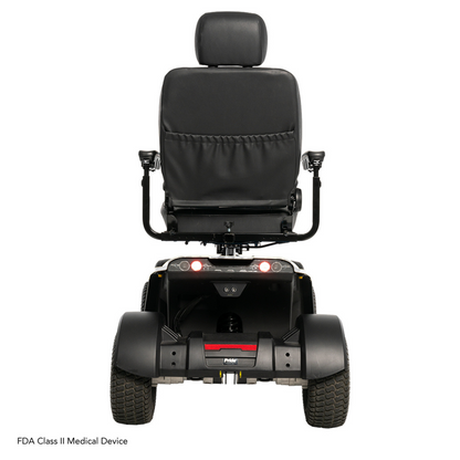 Rear view of the Pride Baja® Wrangler® 2 scooter showing a cushioned backrest, armrests, rear lights, and two sturdy wheels. It features CTS Suspension for a smooth ride and is labeled as an FDA Class II Medical Device in the bottom left corner.