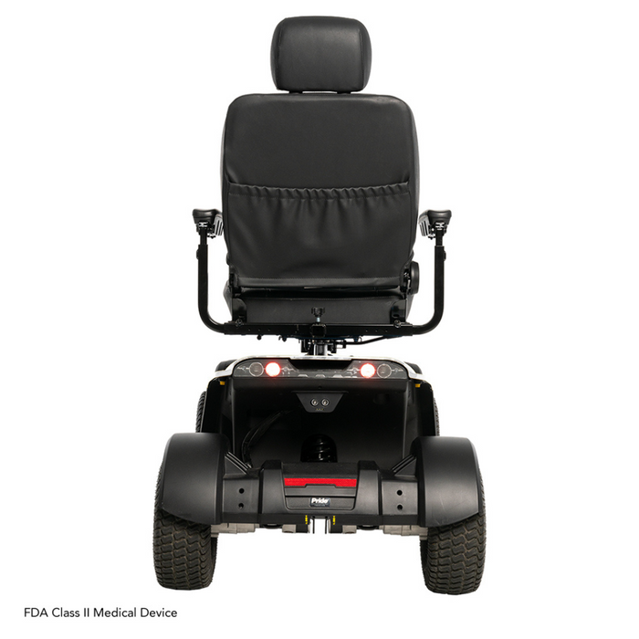 Rear view of the Pride Baja® Wrangler® 2 scooter showing a cushioned backrest, armrests, rear lights, and two sturdy wheels. It features CTS Suspension for a smooth ride and is labeled as an FDA Class II Medical Device in the bottom left corner.