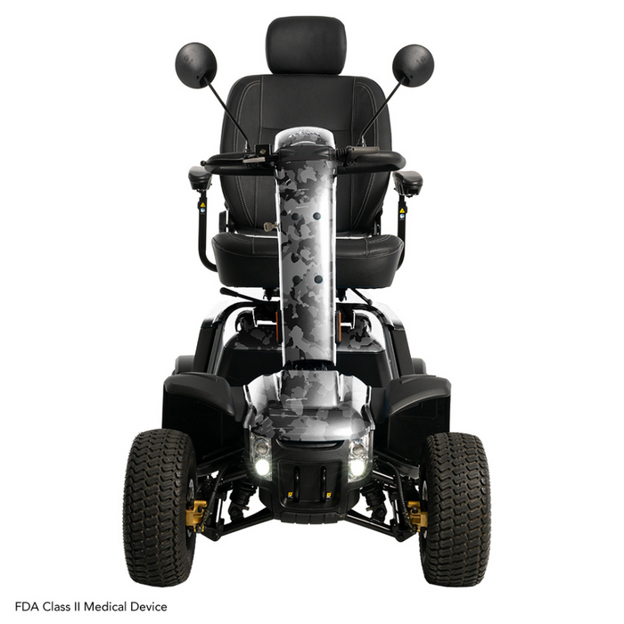 The Pride Baja® Wrangler® 2 Heavy Duty Outdoor Scooter is a rugged mobility scooter with CTS Suspension, large tires, two rearview mirrors, a camouflaged body with a cushioned seat and armrests, front headlights for visibility, and is an FDA Class II Medical Device perfect for rough terrains.
