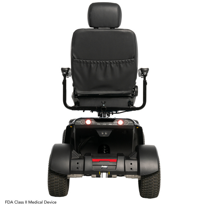 The rear view of the Pride Baja® Wrangler® 2 Heavy Duty Outdoor Scooter flaunts a cushioned seat, armrests, large wheels for rugged terrain, two small red lights, and a backrest. It features CTS Suspension and displays FDA Class II Medical Device at the bottom for added comfort.