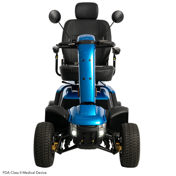 The front view of the Pride Baja® Wrangler® 2 Heavy Duty Outdoor Scooter shows a blue, four-wheel outdoor mobility scooter with CTS Suspension for rugged terrain, a black seat and headrest, mirrors, large tires, and headlights. An FDA Class II Medical Device text appears in the bottom corner.