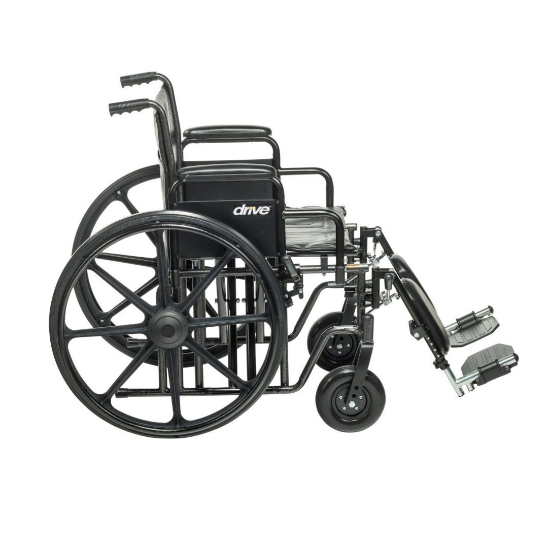 The Drive Bariatric Sentra EC Heavy-Duty Wheelchair, shown in black with large rear wheels, two small front wheels, armrests, footrests, and "drive" branding on the seat back, is empty and displayed from a side view.