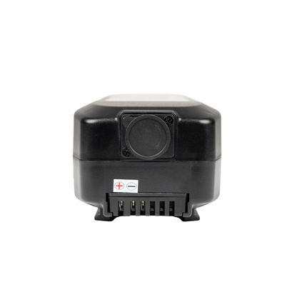 The Battery for Forcemech Carbon F1 Power Chair is a compact black rectangular battery with a circular port, metal connectors, and polarity markings—an ideal lightweight power source for portable convenience.