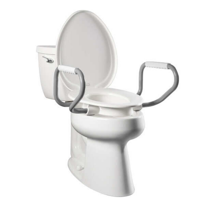The Bemis Assurance® with Clean·Shield 3 Premium Raised Toilet Seat is a white toilet featuring gray support arms for user assistance. It has a modern design with a standard tank and bowl, enhanced by Stay•Tite installation for secure placement.