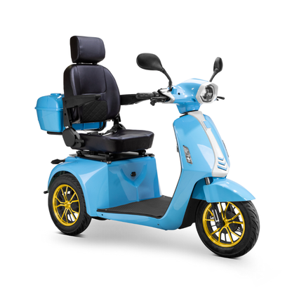 The Bespoke Elite Recreational 3-Wheel Scooter with Electric Brake Assist is shown at an angle on a white background in light blue, featuring a 600-watt motor, cushioned seat, armrests, backrest, rear storage box, and gold-colored wheels for tall riders.