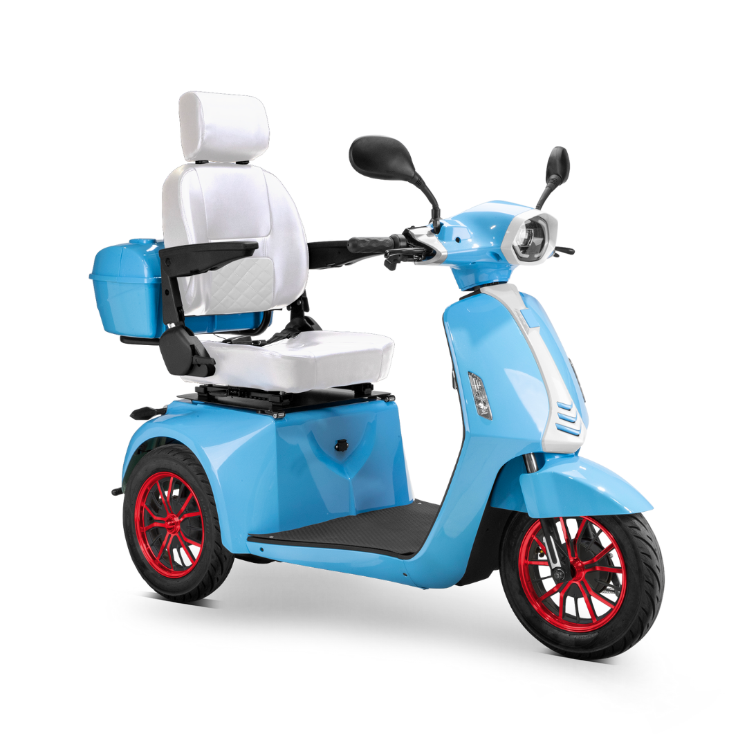 The Bespoke Elite Recreational 3-Wheel Scooter with Electric Brake Assist features a light blue frame, digital speedometer, red rims, white padded seat and backrest, rear storage box, and black handlebars with mirrors—ideal for comfortable rides even for tall users.