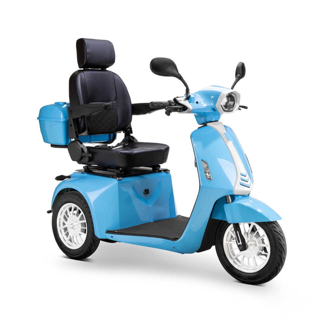 The Bespoke Elite Recreational 3-Wheel Scooter with Electric Brake Assist is light blue, has a black cushioned seat, backrest, armrests, a digital speedometer, white rims, rear storage box, and suits tall riders.