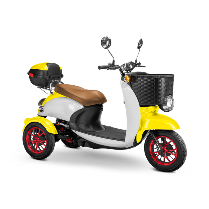 The Bespoke Supreme Euro-Style Recreational 3-Wheel Scooter with Electric Brake Assist is shown from a front-side angle, featuring a yellow and white body, brown seat, front basket, rear box, red-rimmed wheels, and a 600-watt motor.