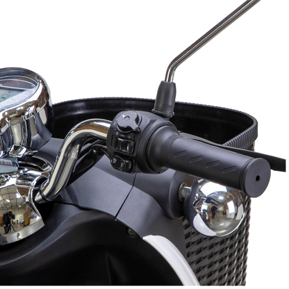 Close-up of the right handlebar on the Bespoke Supreme Euro-Style Recreational 3-Wheel Scooter with Electric Brake Assist, showing the throttle, control buttons, rearview mirror, basket detail, and reflections on chrome and black surfaces.
