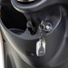 Close-up of the Bespoke Supreme Euro-Style Recreational 3-Wheel Scooter’s ignition with keys and black remote; the advanced black dashboard features a storage compartment next to the ignition switch.