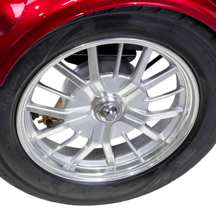Close-up of a shiny silver alloy wheel with black tire on the Bespoke Supreme Euro-Style Recreational 3-Wheel Scooter with Electric Brake Assist, showcasing detailed spokes and part of the fender—highlighting its advanced technology.