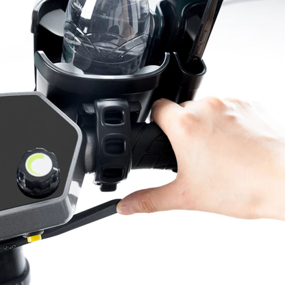 A hand grips a black scooter handlebar equipped with the Bottle & Phone Holder Combo for ScootNgo Scooters, showcasing the accessory’s convenience with its integrated control knob and mounted water bottle.