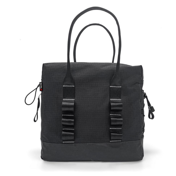The ByAcre Accessories for Overland Carbon Fiber Rollators features a chic black tote bag with two top handles. Its minimalist, textured design is complemented by side zippers and loop details, offering a sturdy square shape that combines functionality and modern style.