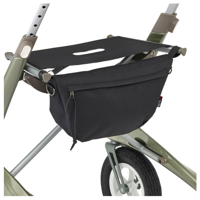 A sleek black fabric storage bag is tucked under the ByACRE Carbon Overland All-Terrain Rollators carbon fiber frame. With a secure zipper closure, it hangs gracefully between metallic legs above a wheel with pneumatic tires, ready to tackle any terrain with modern elegance.