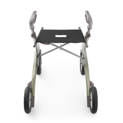 The ByACRE Carbon Overland All-Terrain Rollator features a lightweight, foldable carbon fiber frame with four wheels and a sleek, curved design. It has padded handles and a black seat with a grip cutout, viewed from the front.