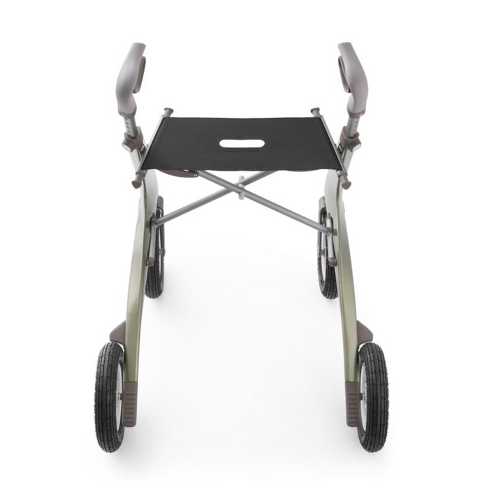 The ByACRE Carbon Overland All-Terrain Rollator features a lightweight, foldable carbon fiber frame with four wheels and a sleek, curved design. It has padded handles and a black seat with a grip cutout, viewed from the front.
