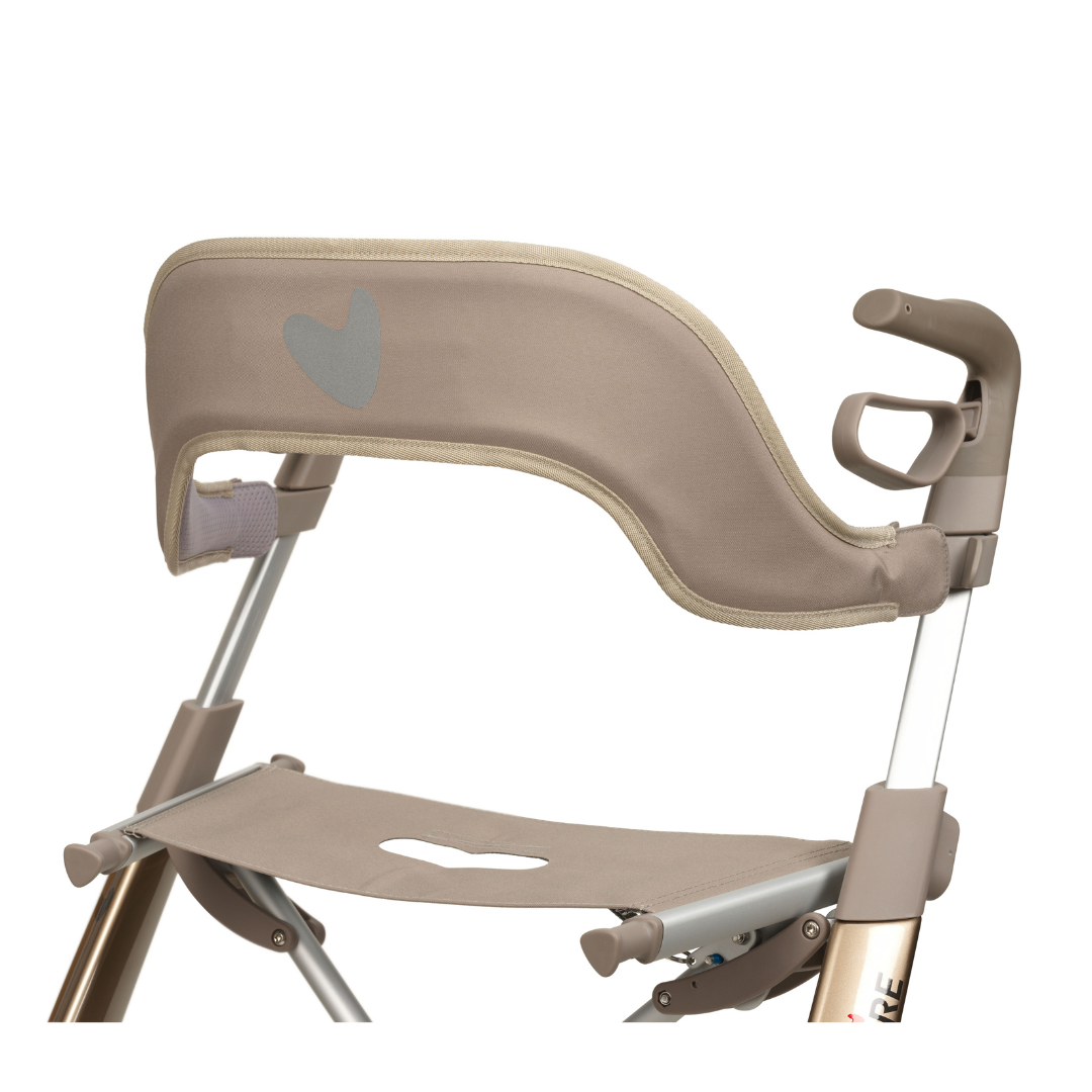 A close-up of the beige Backrest for ByAcre Ultralight Carbon Fiber Rollators, featuring a heart design on its fabric seat and backrest. The metallic frame includes armrests. Displayed against a plain white background.