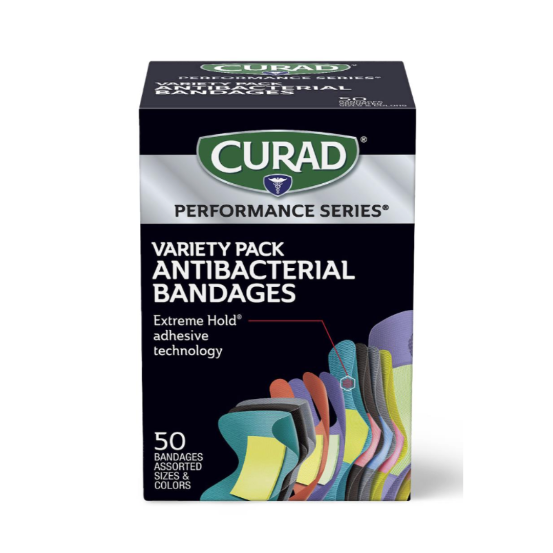 A box of Medline CURAD Performance Series Antibacterial Bandages, variety pack, includes 50 assorted sizes and colors with Extreme Hold adhesive technology. The front displays colorful bandages.