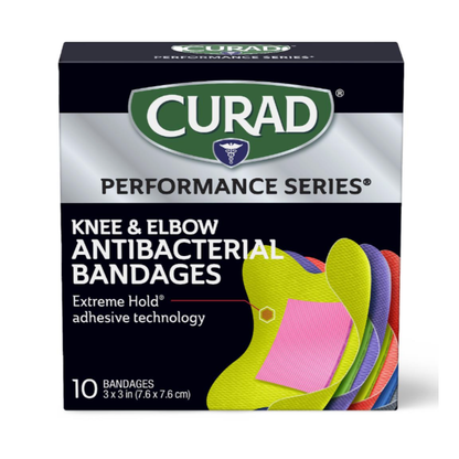 A box of Medline CURAD Performance Series Antibacterial Bandages with Extreme Hold adhesive. Includes 10 colorful 3 x 3-inch bandages for knees and elbows, offering trusted antibacterial protection.