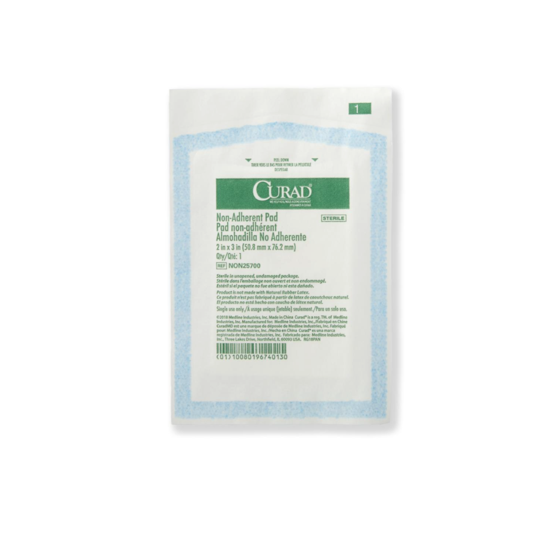 A sealed package of Medline CURAD Sterile Nonadherent Dressing Pads, 2 x 3 inches, features blue and green labeling on a white background with visible packaging text and barcode on the front.