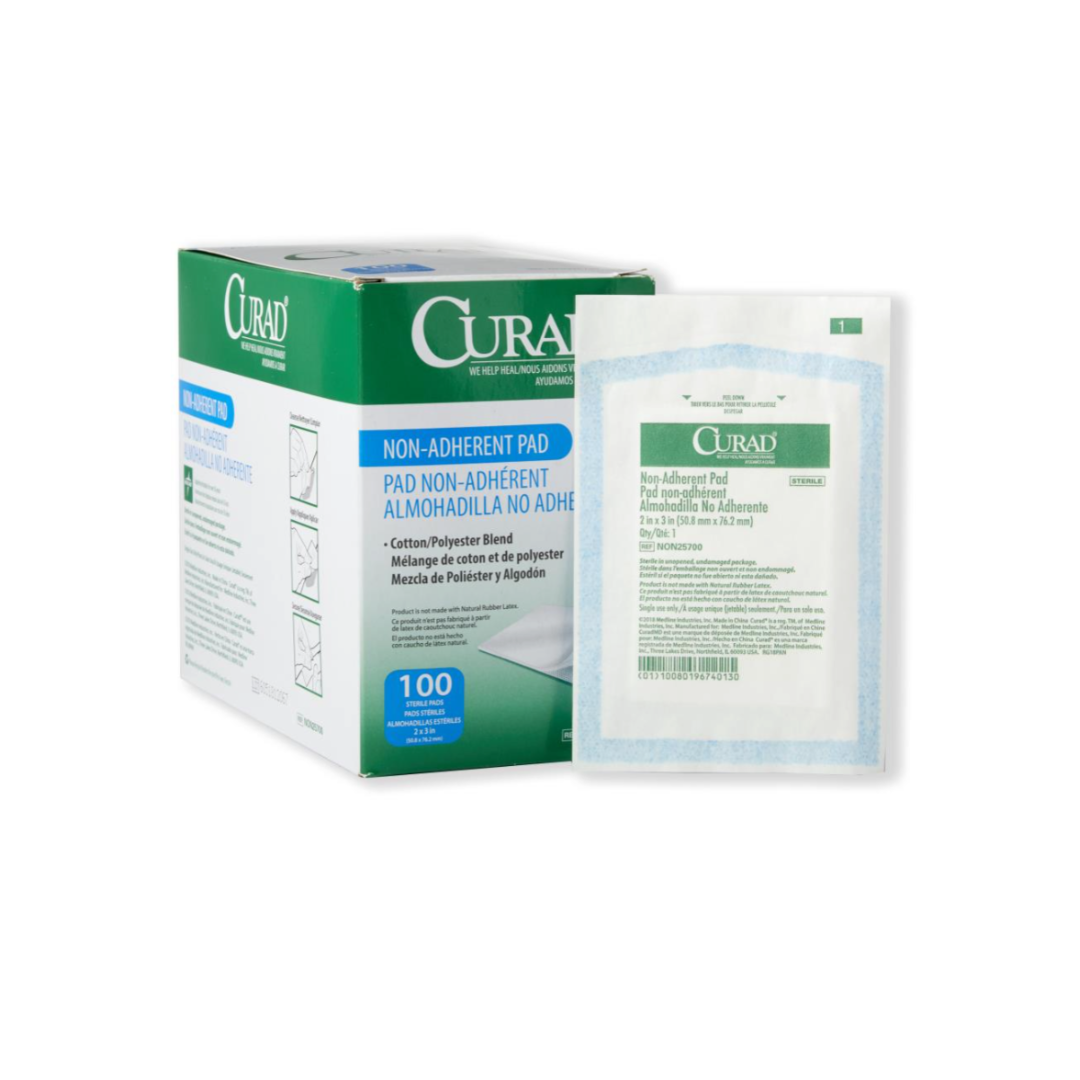 A green and white Medline CURAD Sterile Nonadherent Dressing Pads box with English and Spanish details sits beside an individually wrapped, sterile non-adherent pad. The box contains 100 pads.