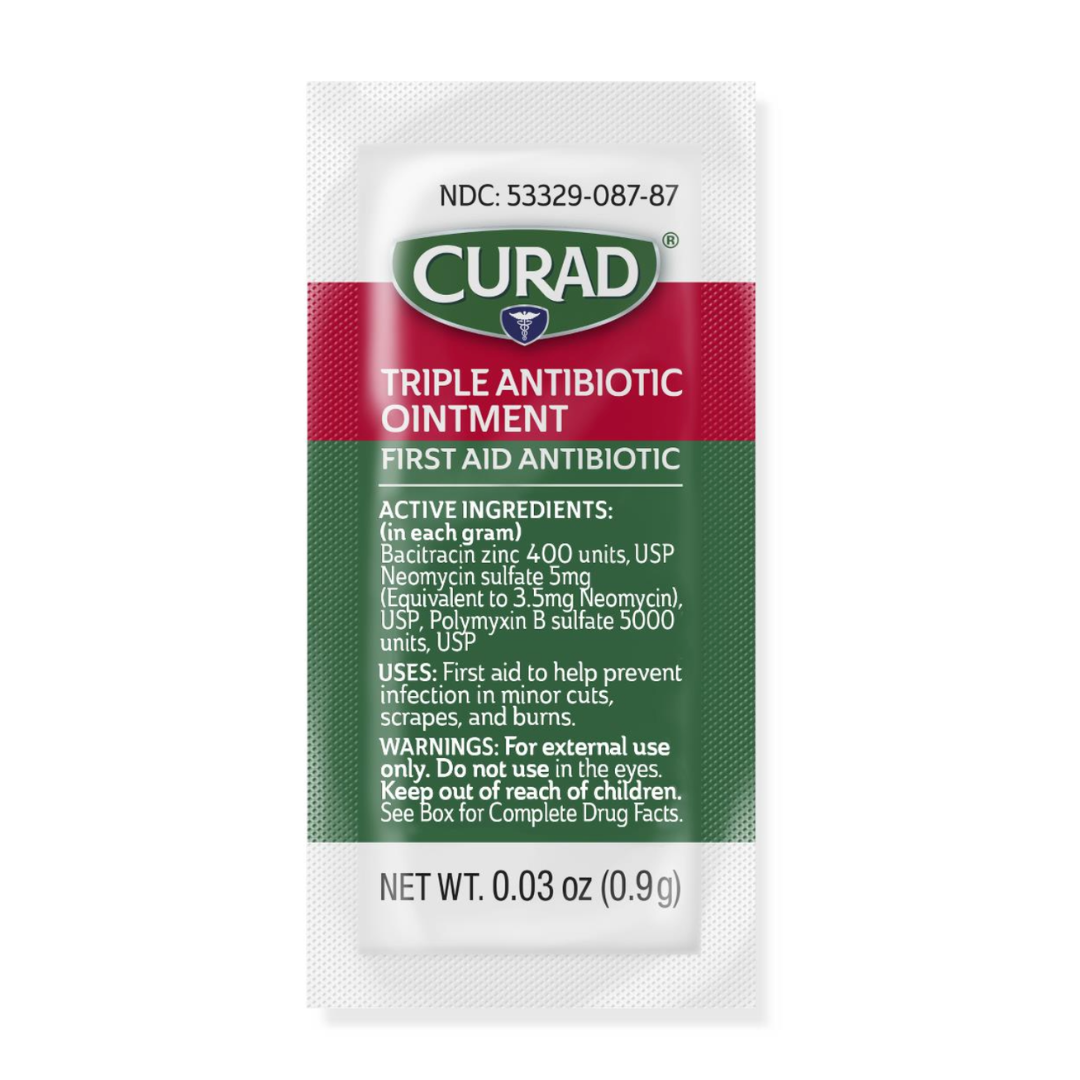 A small white packet of Medline CURAD Triple Antibiotic Ointment with green and red labeling lists active ingredients, usage instructions, and warnings. Each 0.03 oz (0.9g) packet offers hospital-quality protection.