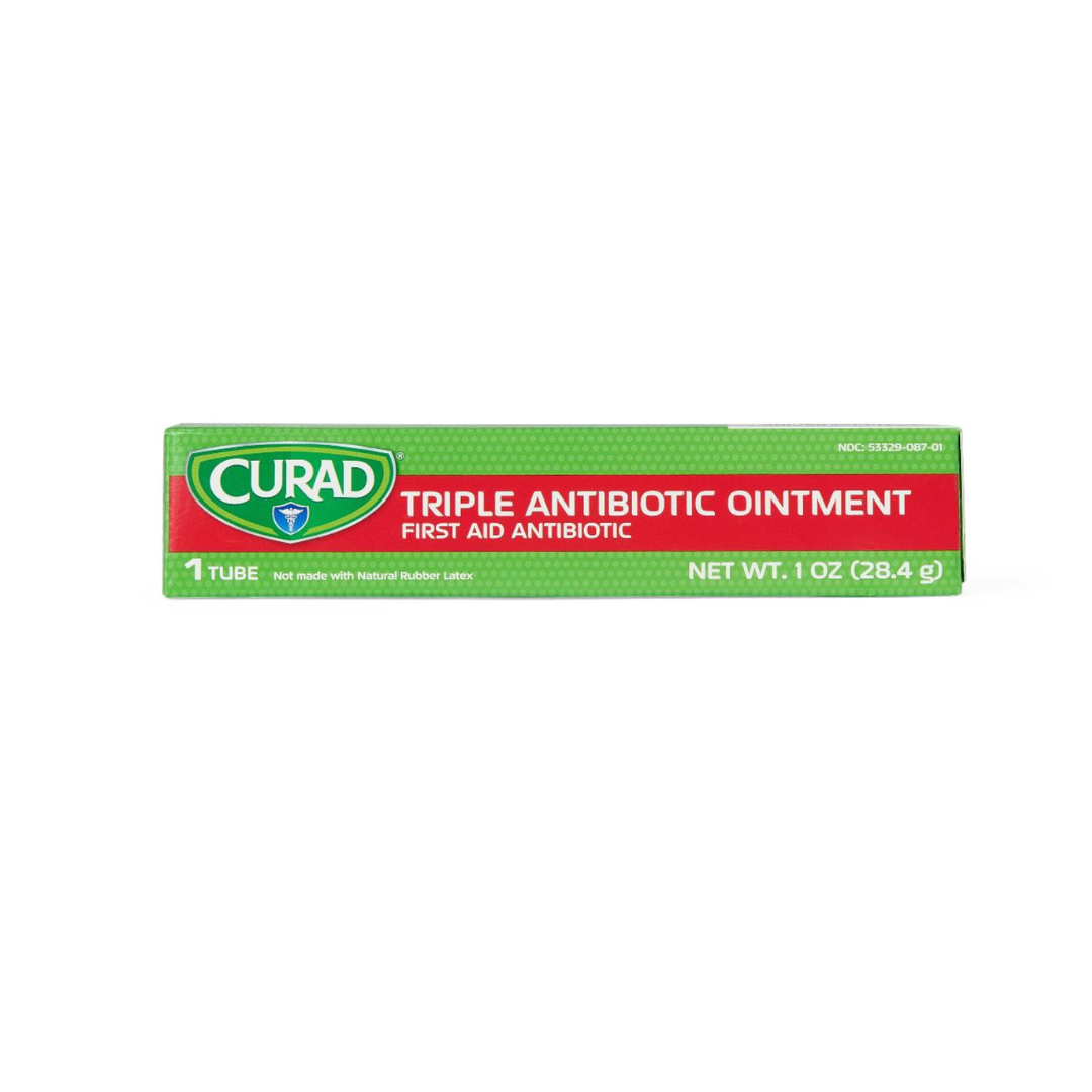 A green and red box of Medline CURAD Triple Antibiotic Ointment, 1 oz (28.4g), hospital-quality first aid antibiotic, not made with natural rubber latex.