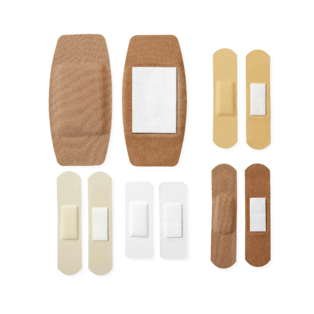 CURAD Variety Pack Assorted Bandages - 4-Sided Seal Protection shown in multiple sizes and skin tones, neatly arranged on a white background. Each bandage includes an absorbent pad for reliable wound care.