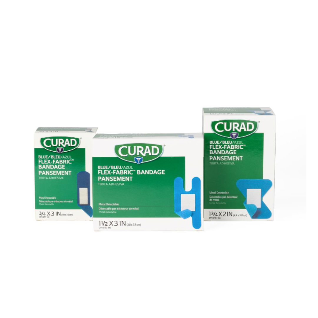 Three boxes of CURAD Food Service Metal-Detectable Blue Fabric Adhesive Bandages are shown, each with product name and size on white and green packaging featuring blue bandage illustrations for food service and easy detection.