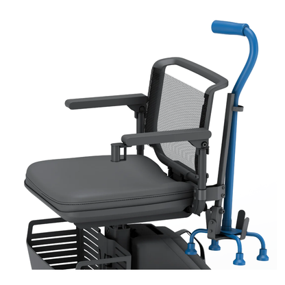 The Cane Holder for WHILL Model R Scooters, shown here in blue and attached to the seat's side, securely holds a cane. A mesh backrest, padded armrests, and a partially visible basket add comfort and convenience.