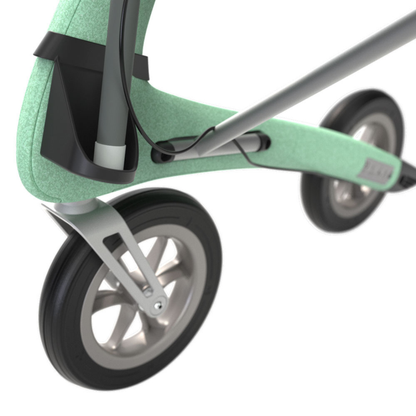 Close-up of the front wheel and frame of a modern, mint green stroller with a sleek design and an integrated Cane Holder For byACRE Nordic Pioneer Rollator for added convenience.