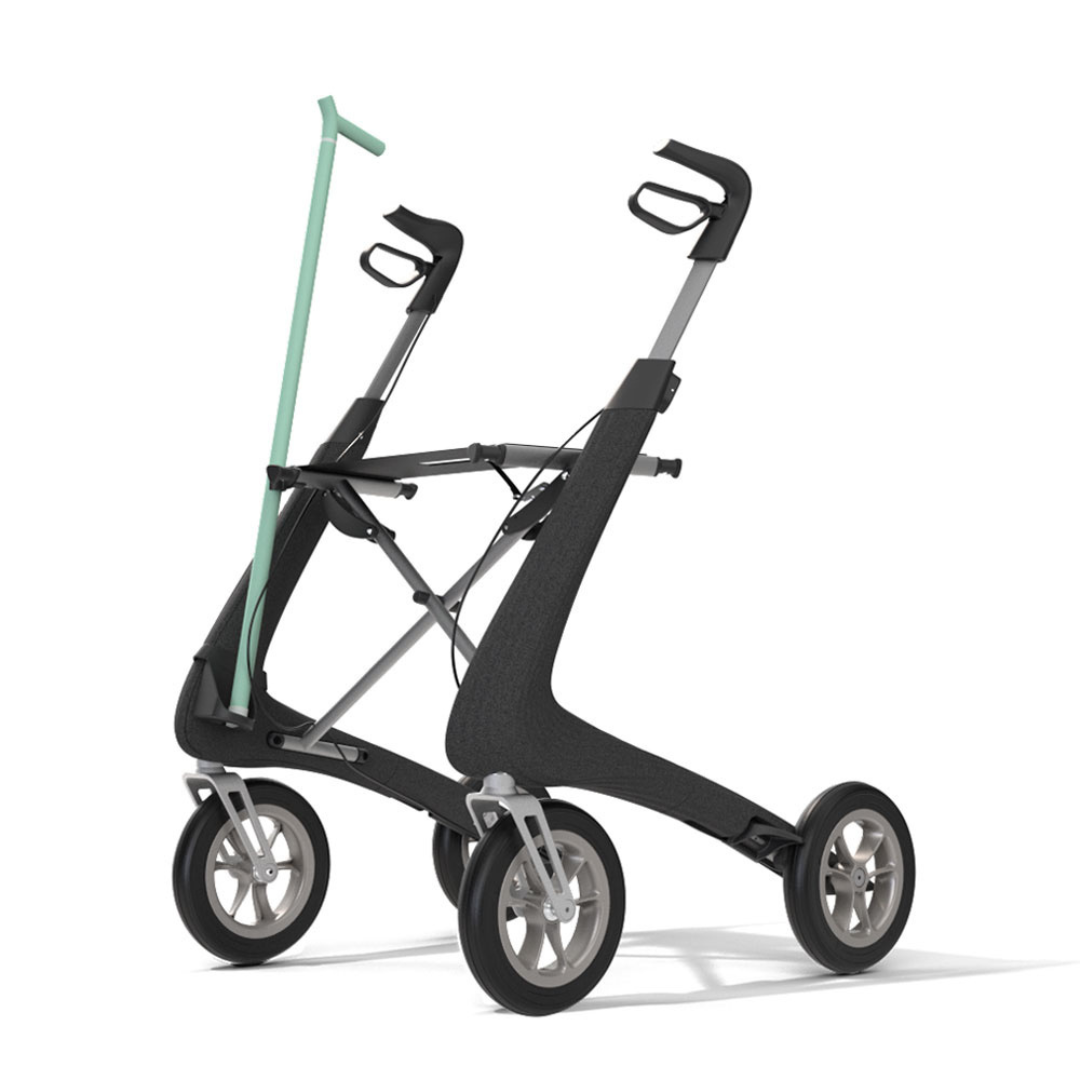A Cane Holder For byACRE Nordic Pioneer Rollator secures a light green cane to a sleek black and silver four-wheeled rollator, displayed against a plain white background.