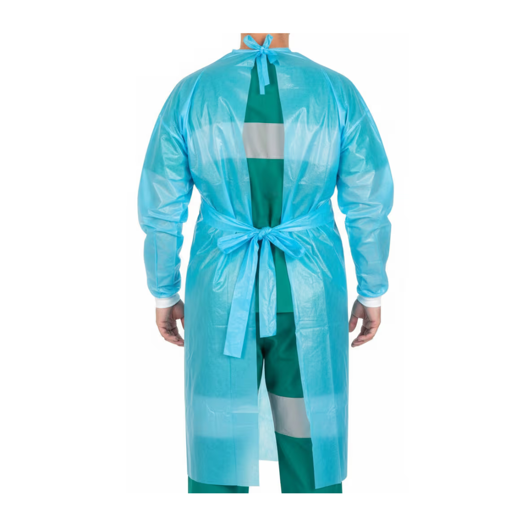 A person wearing a Cardinal Healthcare Impervious Plastic Film Gown - Blue, tied at the waist and neck, is standing with their back to the camera over green scrubs.