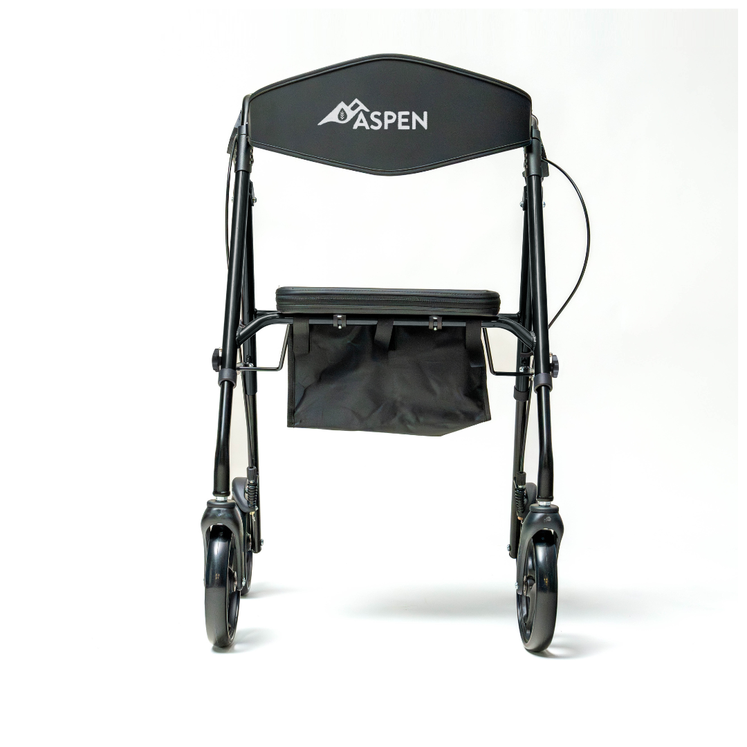 The Carex Aspen Folding Dual-Height Rollator features XL all-terrain wheels, a padded seat, backrest, storage bag under the seat, lightweight aluminum frame, and is shown in black against a plain white background.