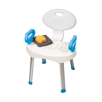 The Carex E-Z Bath and Shower Seat with Handles has a white seat, backrest, blue armrests, and silver legs with blue tips. On the seat are a yellow sponge and dark gray washcloth. The chair is shown against a white background.
