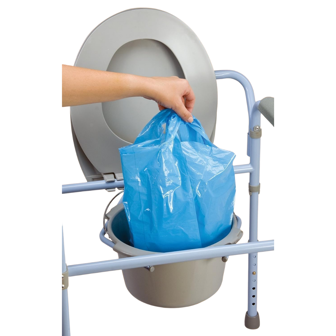 A hand lifts a blue Carex Commode Liner with Absorbent Powder from a gray portable commode chair with metal legs and an open raised seat, showing easy waste disposal and convenient cleanup.