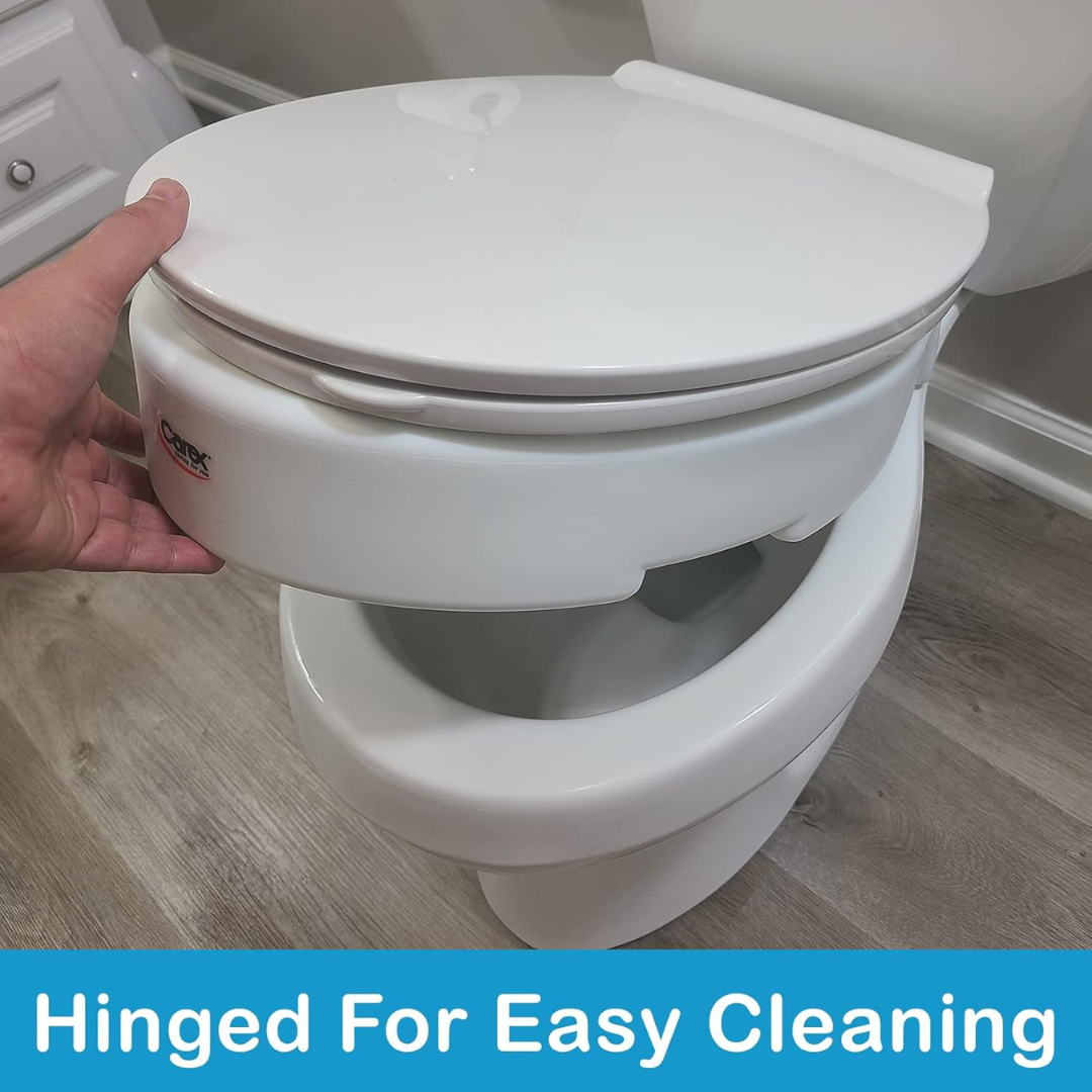 A hand lifts the Carex Hinged Toilet Seat Riser - Add 3.5 Inches, demonstrating how the seat easily raises from the bowl for cleaning. Text at the bottom reads, Hinged For Easy Cleaning.