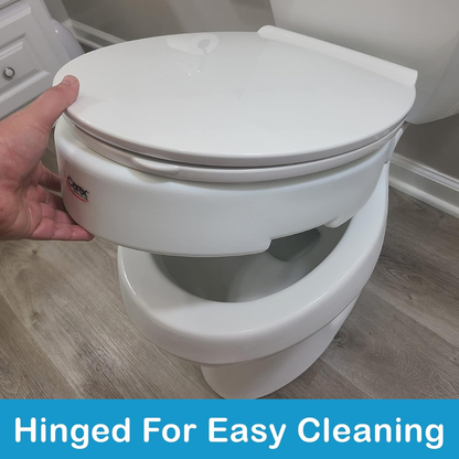 A hand lifts the Carex Hinged Toilet Seat Riser - Add 3.5 Inches, demonstrating how the seat easily raises from the bowl for cleaning. Text at the bottom reads, Hinged For Easy Cleaning.
