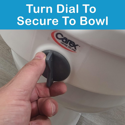 A hand turns a gray dial on a white Carex E-Z Lock 5" Raised Toilet Seat with adjustable armrests. Text above reads, "Turn Dial to Secure to Bowl.