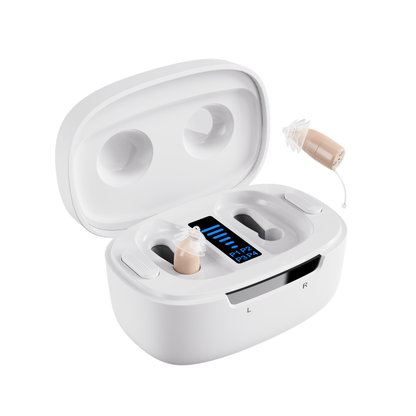 A pair of beige Ceretone Core One Pro Hearing Aids - Invisible-In-Canal with clear earpieces rests in a white charging case, its open lid revealing a digital display that shows battery levels.