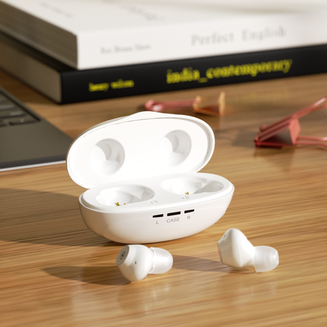 A pair of Ceretone Fusion In-The-Ear OTC Hearing Aids in white sit with their open charging case on a wooden desk near a laptop, with stacked books and pink paper clips visible in the background.