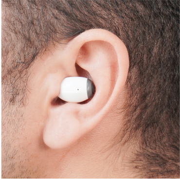 Close-up of a person’s ear wearing Ceretone Style In-Ear OTC Hearing Aids, showing their snug fit. The image highlights the wearer’s short hair and skin texture. See specifications and videos for more details.