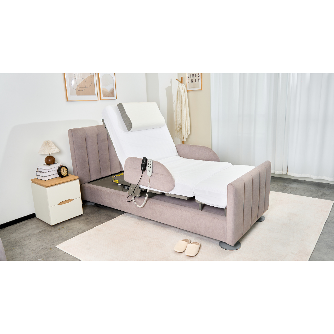 The Charme Starsleep Orin Rotating Full Electric Lift Assist Bed with Heat & Massage, featuring a German motor and remote control, is partially elevated in a bright, tidy bedroom beside slippers and a nightstand with a lamp, book, and decor.