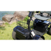 A close-up of the Green Transporter Cheeta Ninja All-Terrain HD Scooter Golf Cart parked on grass by rocks and water, highlighting its front basket, seat, large wheels, and off-road capabilities.