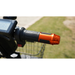 Close-up of a Green Transporter Cheeta Ninja All-Terrain HD Scooter Golf Cart handlebar with a textured black grip, orange metallic end, digital display for its lithium battery, and a basket in the background, outdoors on grass.
