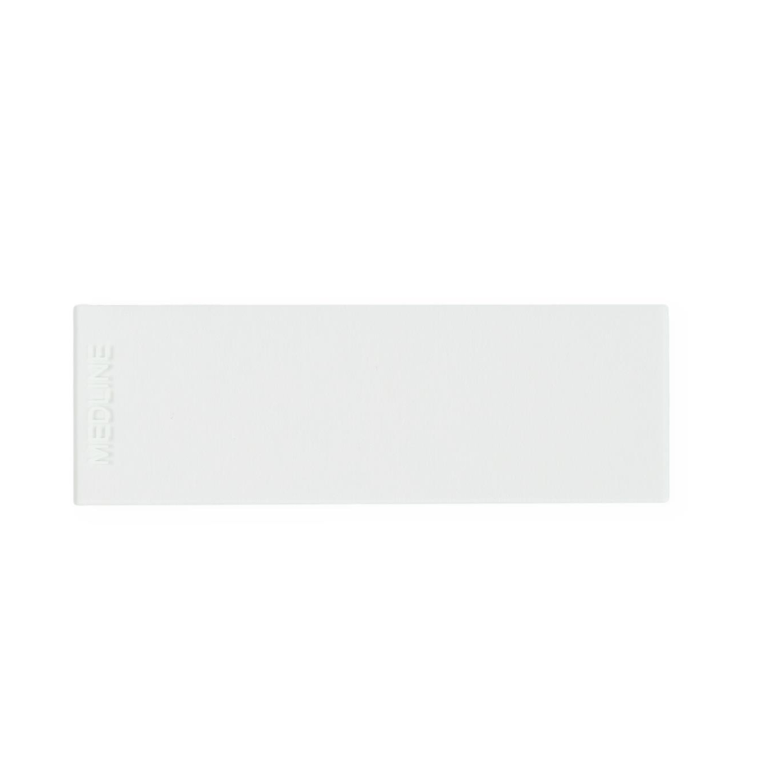 A rectangular, white adhesive bandage with "Medline" embossed on the left edge is shown on a plain white background next to Medline ClearValue Glass Microscope Slides.