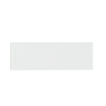 A rectangular, white adhesive bandage with "Medline" embossed on the left edge is shown on a plain white background next to Medline ClearValue Glass Microscope Slides.
